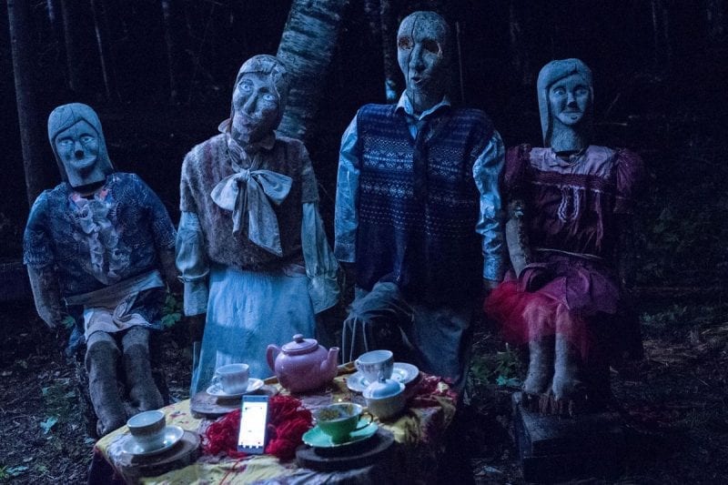 John's mannequin family arranged for a tea party in the woods