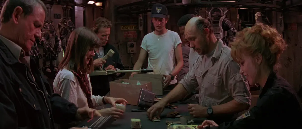 The crew of Shack 7 gathered inside the underwater station in Leviathan 1989