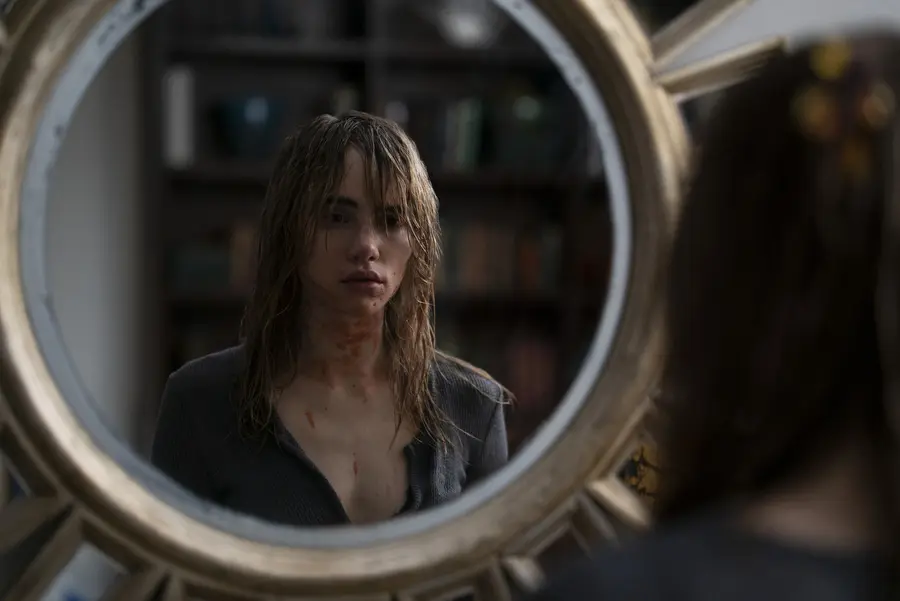 A bloodied Alexis faces herself in a mirror during the final confrontation in New Year New You 2018