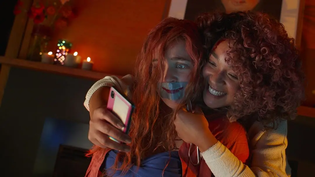 Cecilia poses with a restrained Emma while recreating their childhood friendship in Sissy 2022