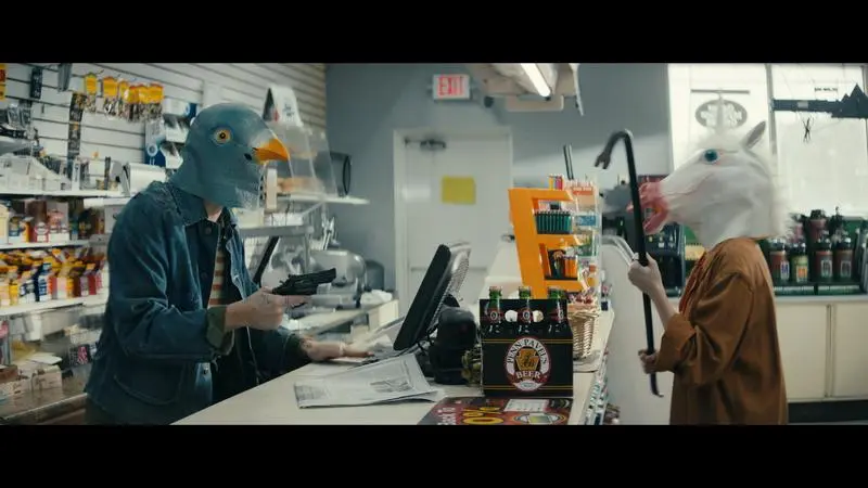 Mickey and Jules wearing animal masks during the convenience-store robbery in Villains